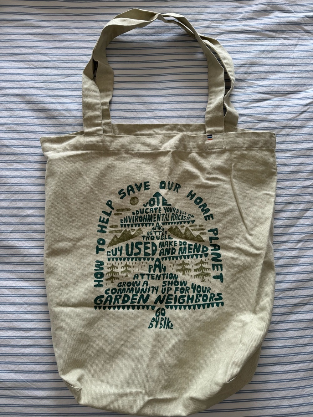 Patagonia canvas tote in light beige with green print
